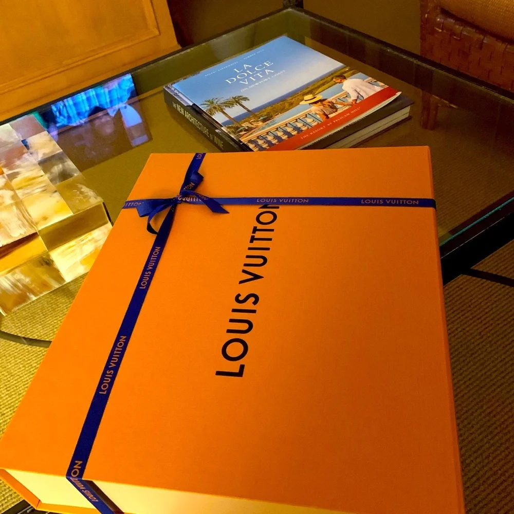 Brand new authentic smaller Luis Vuitton box with ribbon . Must have for closet!